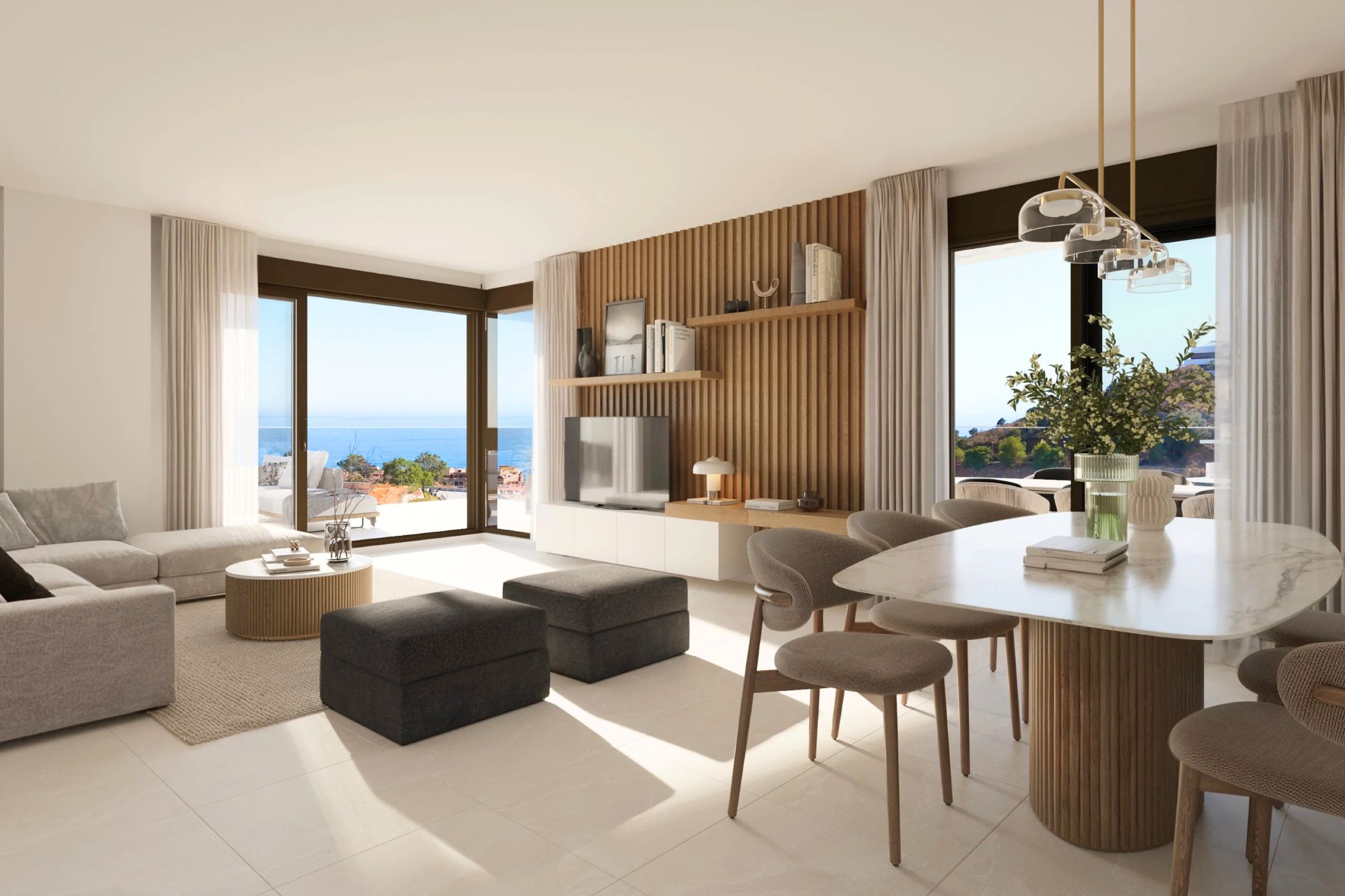 Open-plan living and dining room with Mediterranean views shown in the Rincón de la Victoria listing